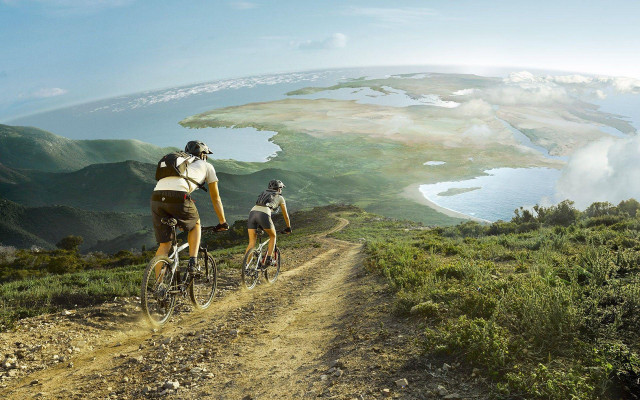 Couple biking dirt road lake free wallpaper - medium preview image