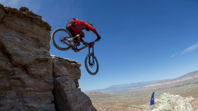 Man bike jumping cliff mountain free wallpaper - medium preview image
