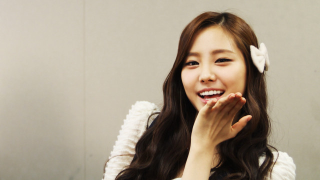 Woman long hair smiling hands free wallpaper - medium preview image