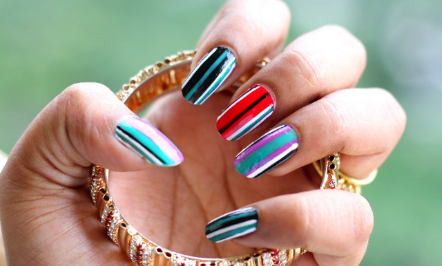 Woman holding ring multicolored nails free wallpaper - medium preview image