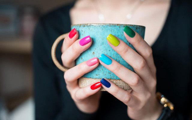 Woman holding cup colorful nails free wallpaper - medium preview image