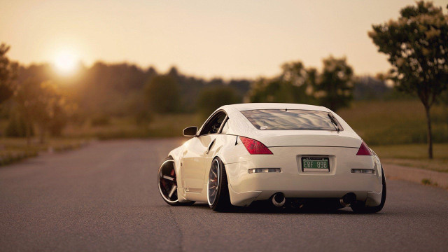White car parked trees grass free wallpaper - medium preview image