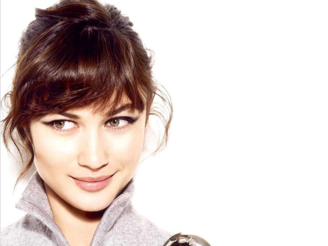 Woman messybun greyjacket portrait browneyes free wallpaper - medium preview image