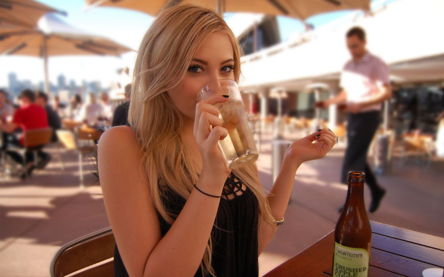 Woman drinking beer table man free wallpaper - medium preview image