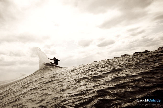 Surfboard riding wave ocean cloudy free wallpaper - medium preview image