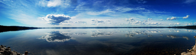 Lake clouds rocks shore scenery free wallpaper - medium preview image