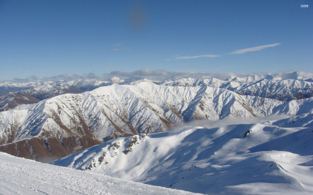 Snowboarder snowy mountain top background #2 free wallpaper - medium preview image