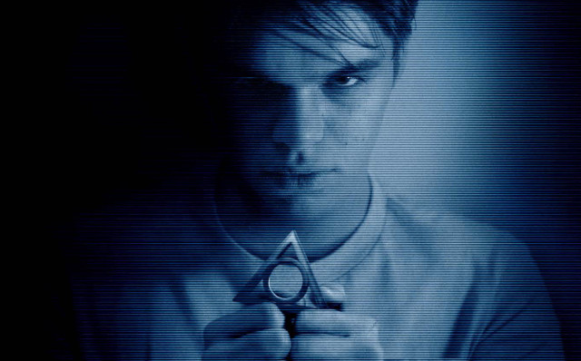 Man holding scissors dark room free wallpaper - medium preview image