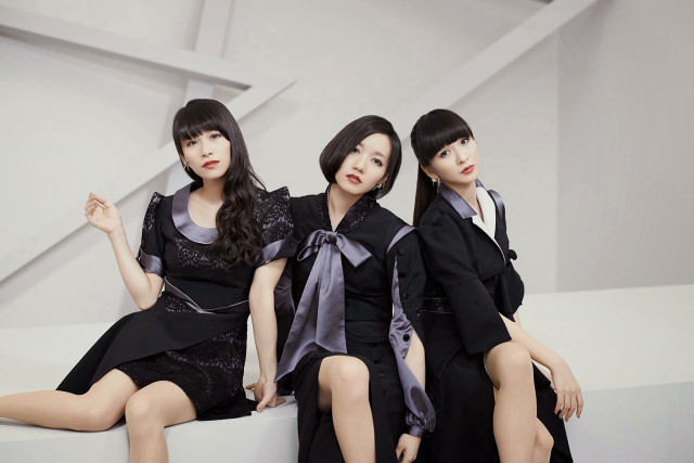 Three women black dresses sitting free wallpaper - medium preview image
