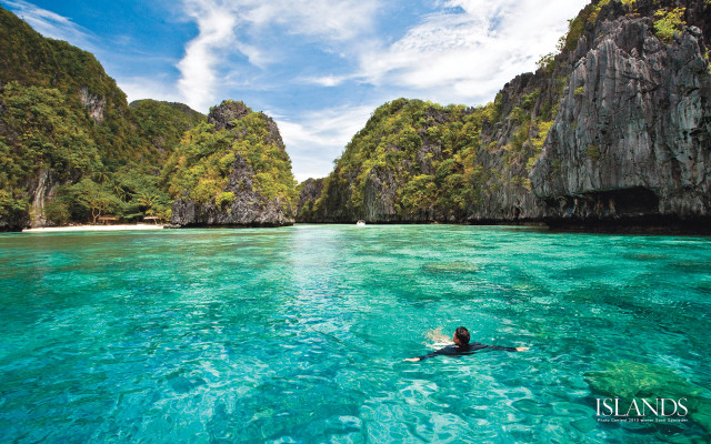 Swimming lagoon cliffs blue sky free wallpaper - medium preview image