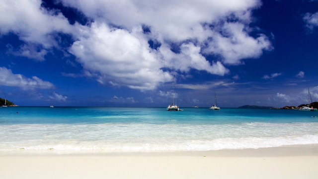 Beach boats clouds white sand free wallpaper - medium preview image