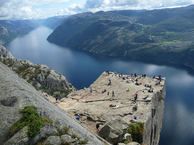 Cliff lake mountains group people free wallpaper - medium preview image
