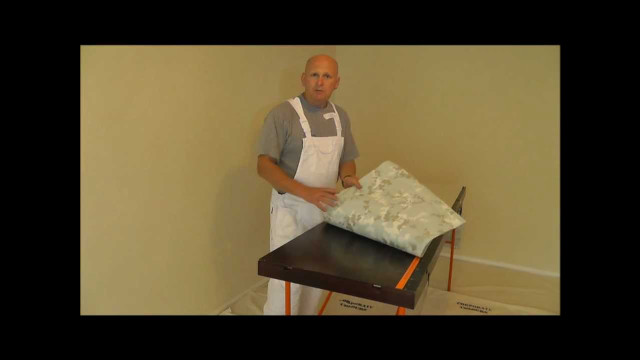 Man apron holding fabric table free wallpaper - medium preview image