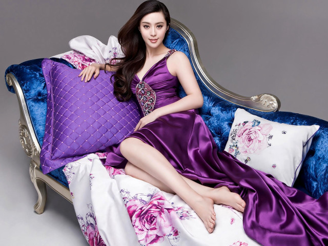 Woman purple dress blue couch free wallpaper - medium preview image