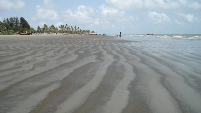 Sandy beach people walking water free wallpaper - medium preview image