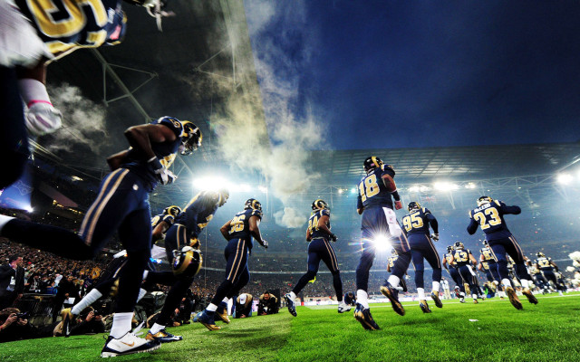 Football players night field lights free wallpaper - medium preview image