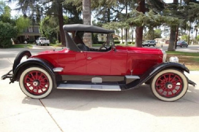 Old red car parked trees free wallpaper - medium preview image