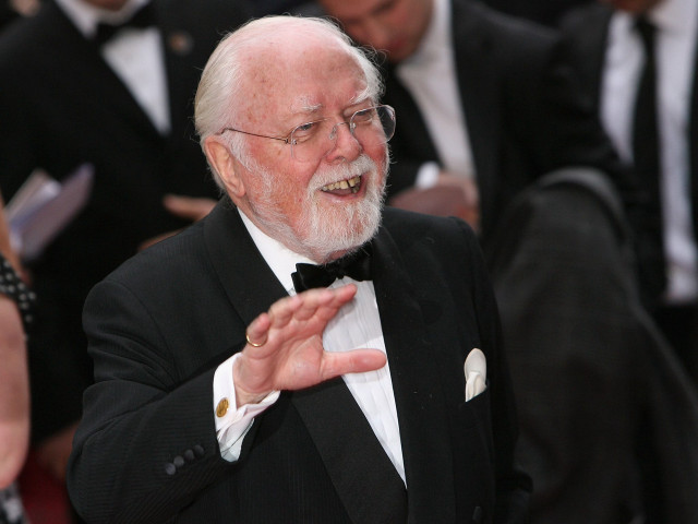 Older man tuxedo gesturing crowd free wallpaper - medium preview image