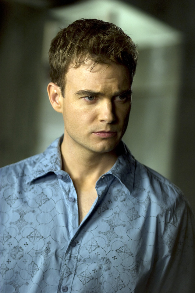 Man blue shirt serious look #3 free wallpaper - medium preview image