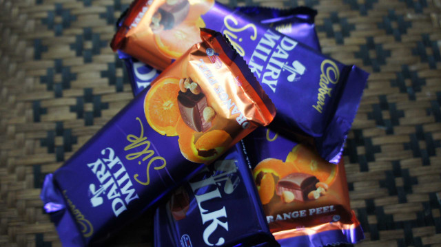 Chocolate bars pile table woven free wallpaper - medium preview image