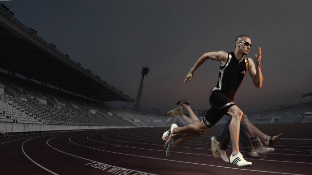 Man running track stadium crowd free wallpaper - medium preview image