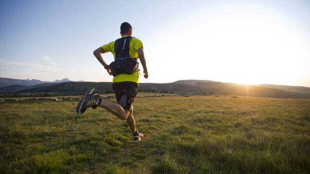 Man running field backpack helmet free wallpaper - medium preview image