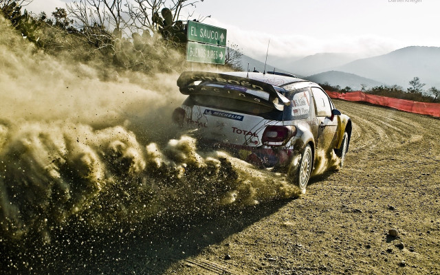 Rally car dirt field sign free wallpaper - medium preview image