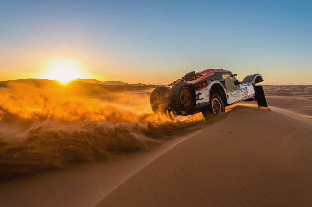 Truck desert sunset dust blowing free wallpaper - medium preview image