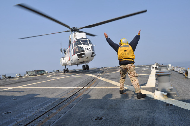 Man yellow jacket ship helicopter free wallpaper - medium preview image