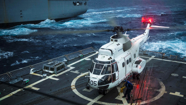 Helicopter ship ocean red light free wallpaper - medium preview image