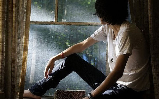 Man sitting window sill looking #2 free wallpaper - medium preview image