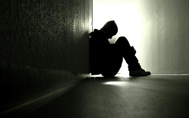 Person sitting dark room feet #2 free wallpaper - medium preview image