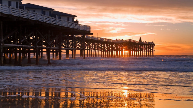 Pier sunset waves crashing person free wallpaper - medium preview image