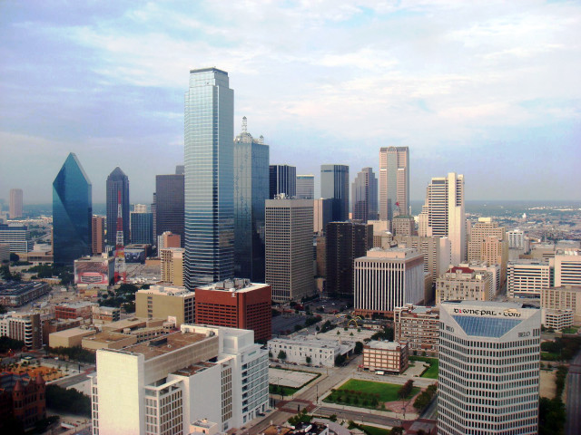 City skyline green field clouds free wallpaper - medium preview image