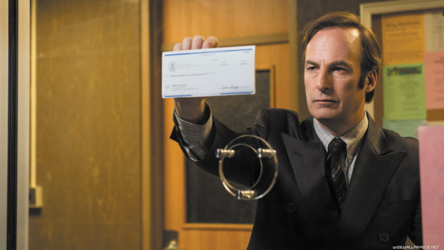 Man suit business card pointing free wallpaper - medium preview image