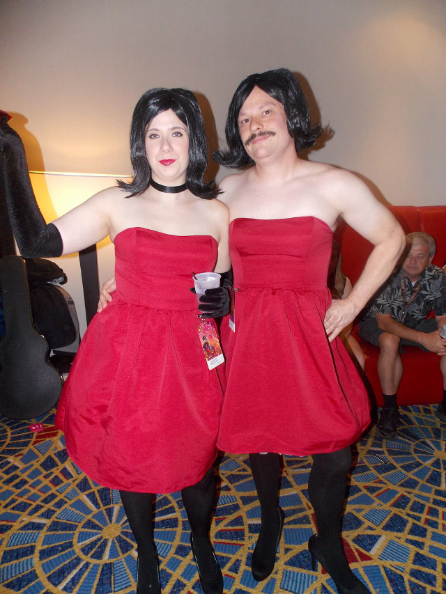 Two women red dresses blue free wallpaper - medium preview image