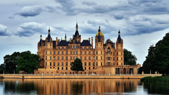 Large building towers water trees free wallpaper - medium preview image