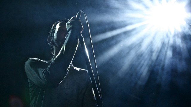 Man holding microphone sky light free wallpaper - medium preview image
