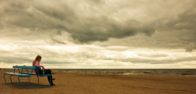 Woman bench beach cloudy sky free wallpaper - medium preview image