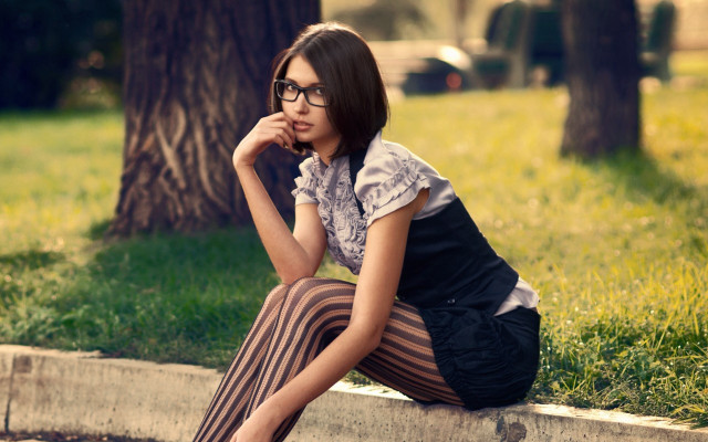 Woman sitting curb tree glasses free wallpaper - medium preview image