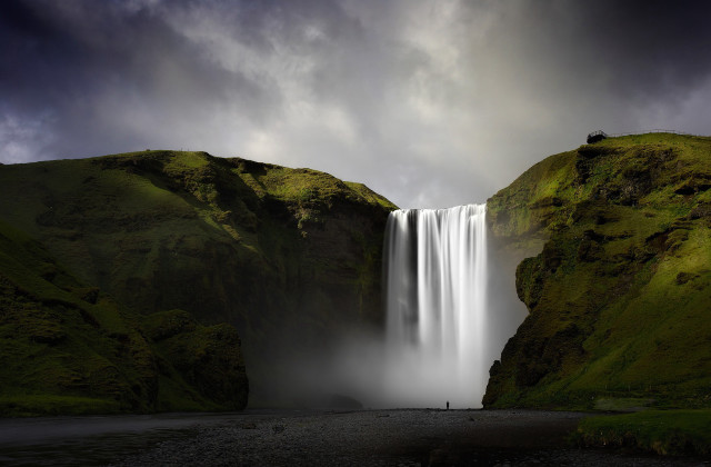 Waterfall person cloudy day dark free wallpaper - medium preview image