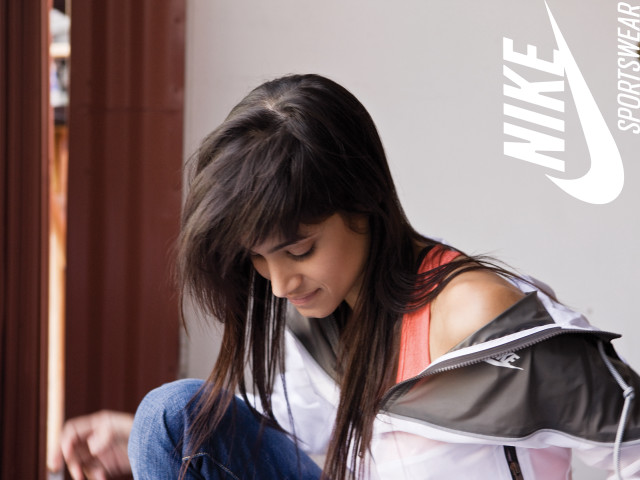 Girl sitting floor cellphone nike free wallpaper - medium preview image