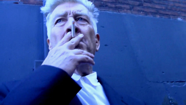 Man suit cigarette looking up free wallpaper - medium preview image