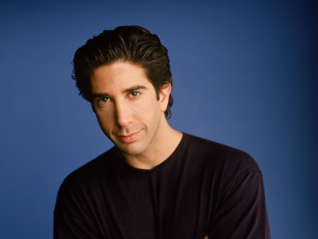 Man black shirt blue background #2 free wallpaper - medium preview image