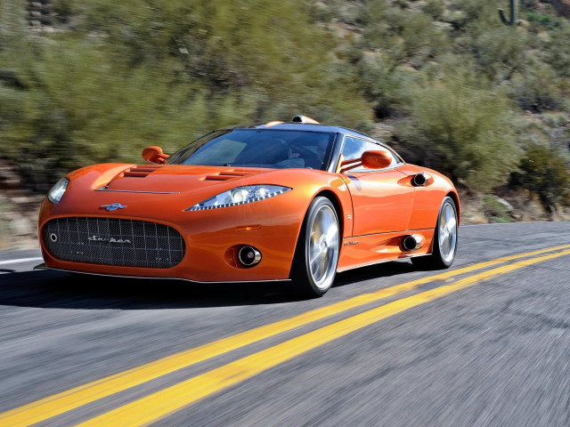 Orange sports car driving road free wallpaper - medium preview image