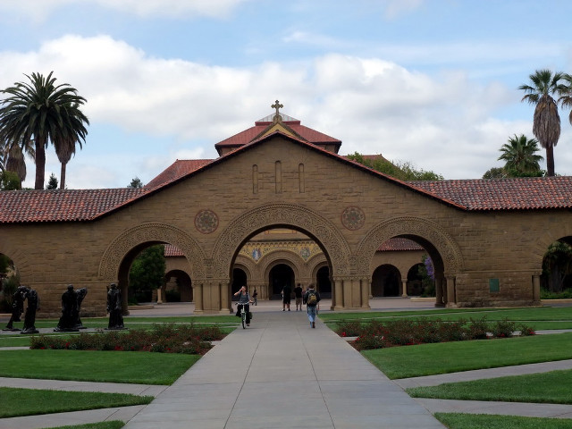 Building walkway clocktower palmtrees tiltshift free wallpaper - medium preview image