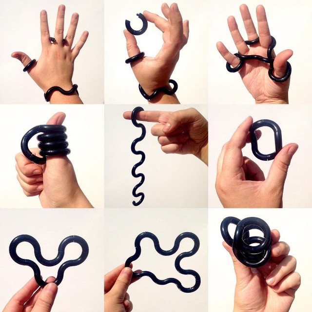 Hands holding black object spiral free wallpaper - medium preview image