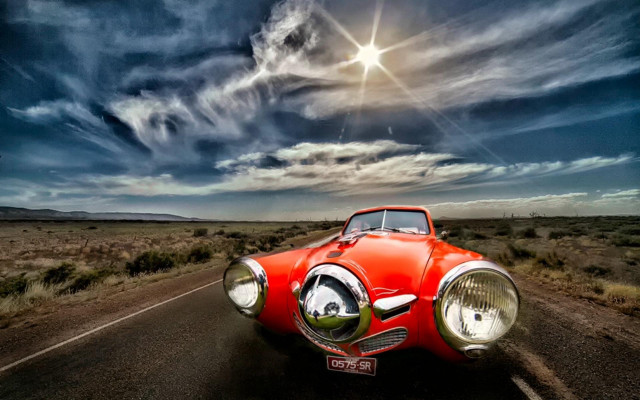Red car cloudy sky sun free wallpaper - medium preview image