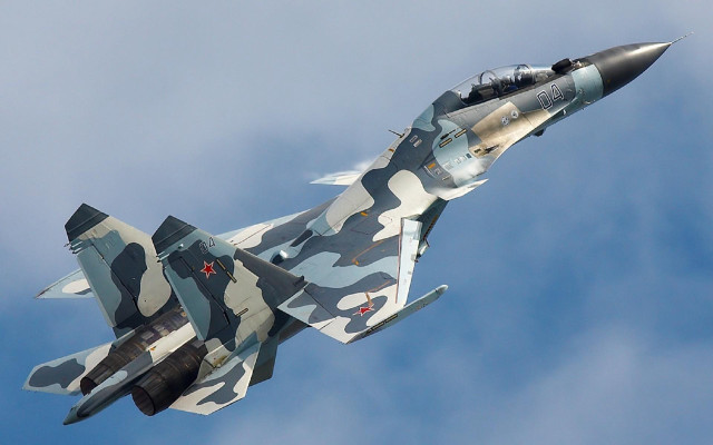 Camouflaged fighter jet cloudy sky free wallpaper - medium preview image