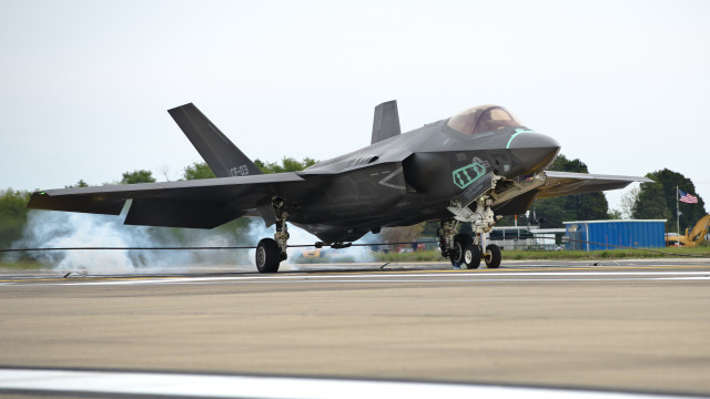 Fighter jet airport runway man free wallpaper - medium preview image